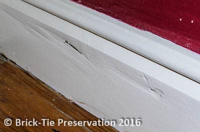 Fig 4: Notice the subtle undulations in the surface? This skirting board wasn’t installed in this condition. It has developed because of Dry Rot attacking the reverse side (Our surveyor has probed with a screwdriver)