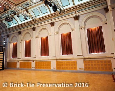 Water damaged surfaces in this 19th century hall, repaired by our technicians using lime based plaster