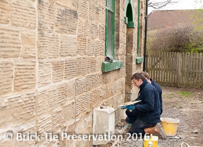 Our technicians applying natural lime pointing to a Methodist Church in Woodlesford, near Wakefield, after removing the damaging cement.