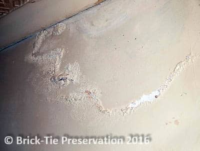 Typical surface damage to plaster caused by penetrating damp