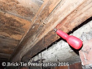 Fig 3: If conditions under a floor are right, wet rot can develop mycelium and fungal strands like here in Harrogate – a screwdriver pushed through by hand.
